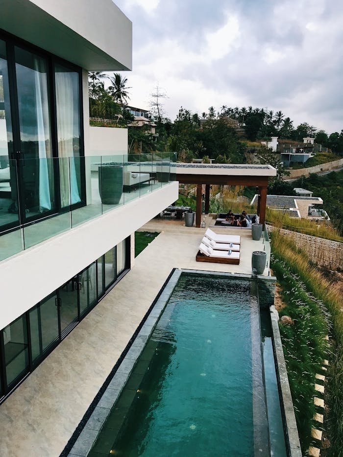 Explore this luxurious resort villa with a stunning infinity pool set in a beautiful Indonesian landscape.